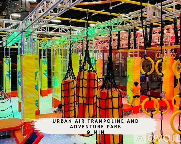 A trampoline and adventure park with a sign that says 9 min.