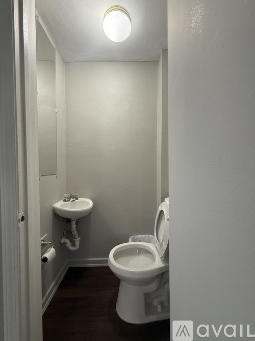 A small bathroom with a toilet and sink.