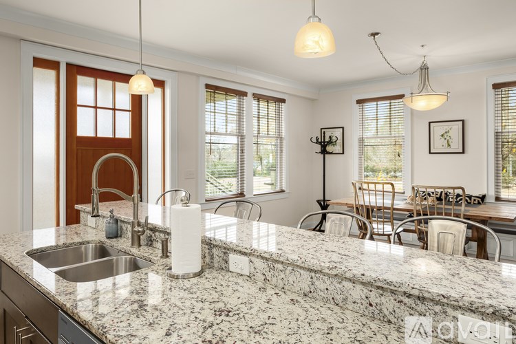 A kitchen with granite countertops and a sink.