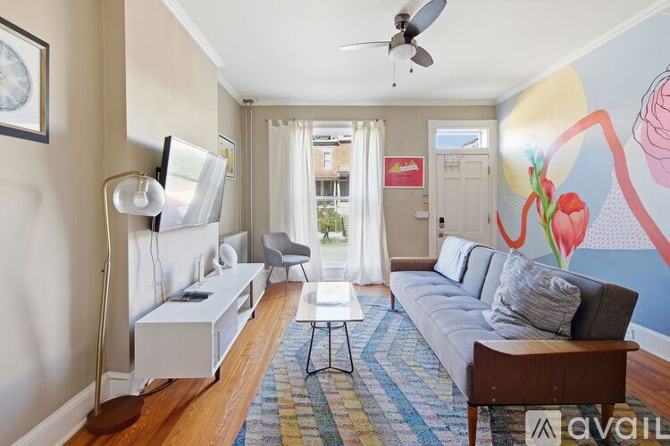 A brick house with a mailbox and a number 305 on the wall.