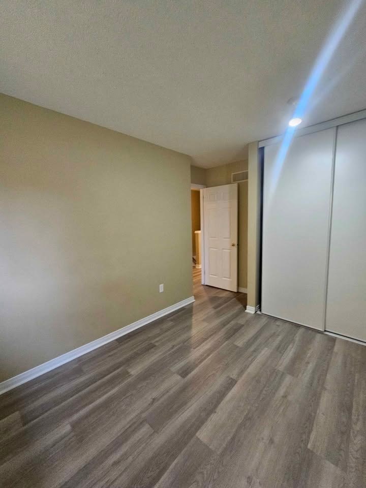 A room with a light on the floor.