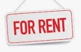A red and white sign that says "FOR RENT".