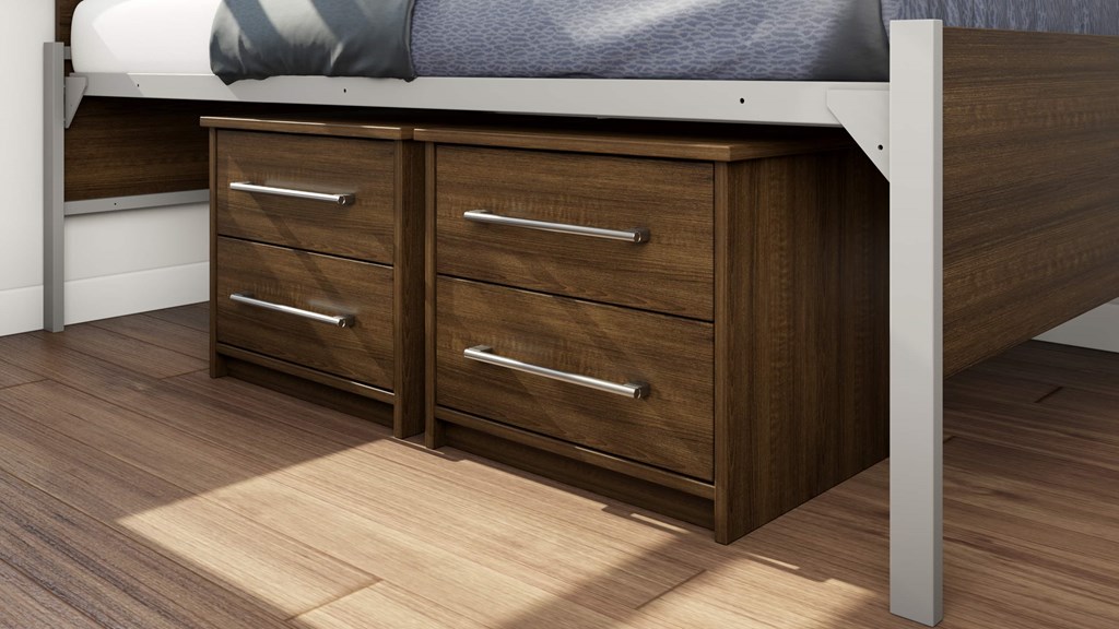 A bed with a white headboard and a wooden dresser underneath it.