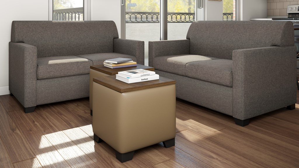 Two grey couches and a coffee table in a room.