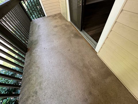 A view of a staircase leading to a door.