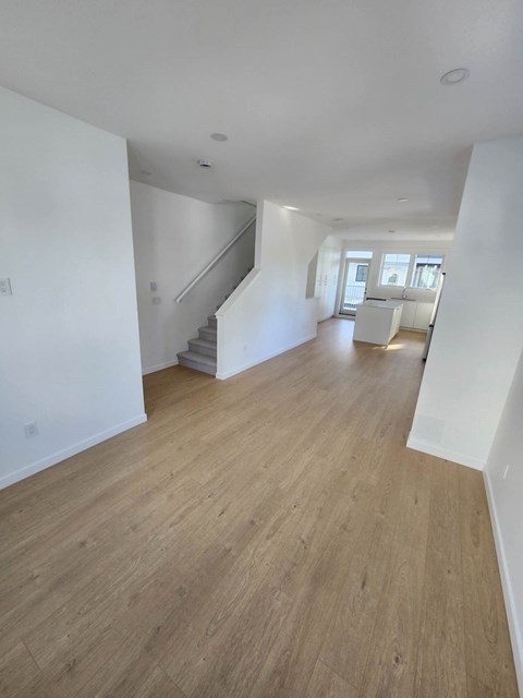 A room with wooden floors and white walls.