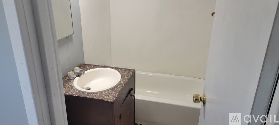 A bathroom with a sink and a bathtub.