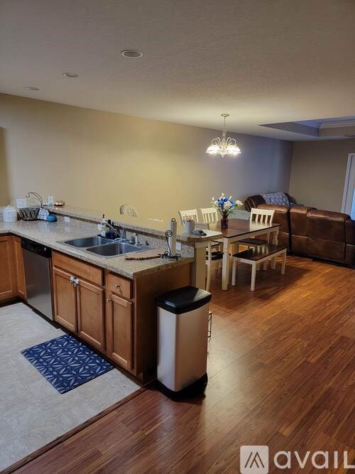 A kitchen with wooden cabinets and a white countertop.