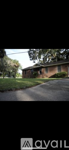 A house with a driveway in front of it.
