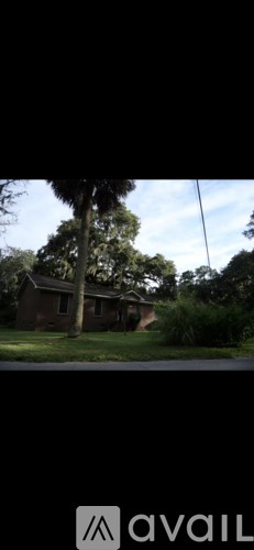 A house with a tree in front of it.