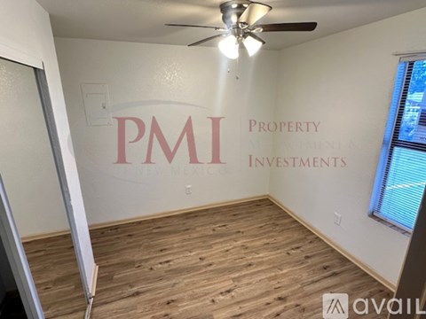 A room with PMI Property Management Investments written on the wall.