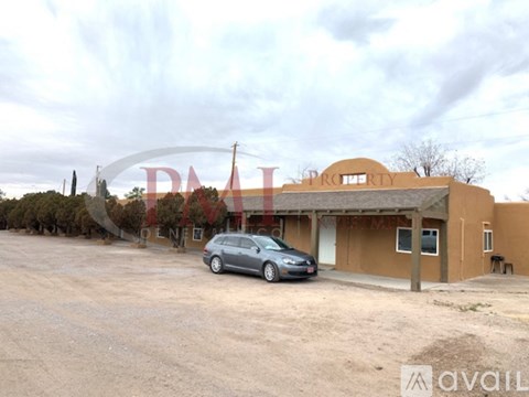 A car is parked in front of a building with the sign "DAILY PROPERTY".