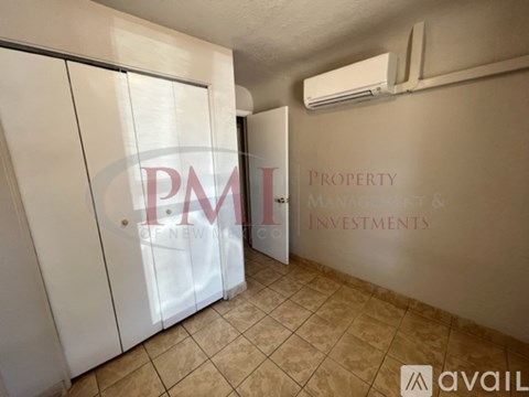 A room with a sign that says "P.M.I. Property Management & Investments".