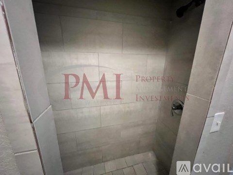 A bathroom with the letters PMI on the wall.