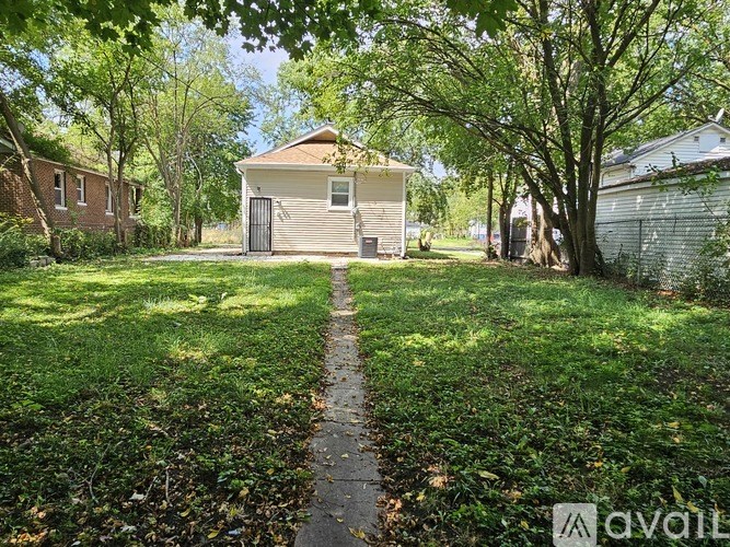 A house with a driveway in front of it.