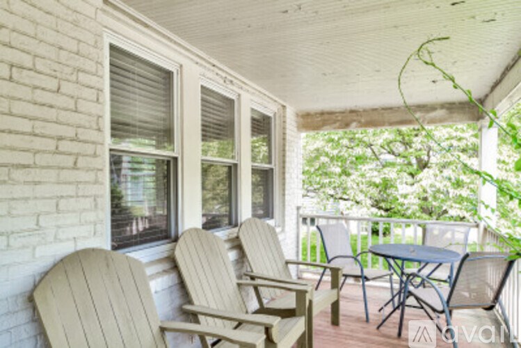 A patio with a table and chairs.