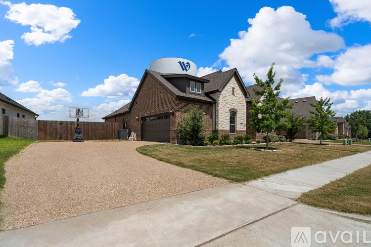 A house with a driveway in front of it.