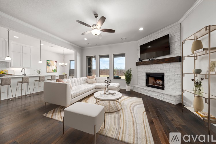 A modern living room with a fireplace and a television.