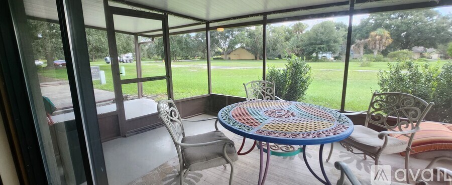 A patio with a round table and chairs is shown.