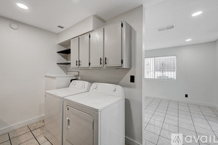 A laundry room with a washer and dryer.