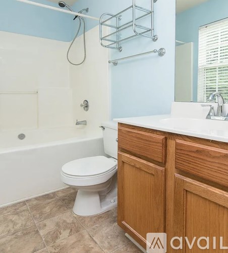 A bathroom with a white toilet and a white sink.