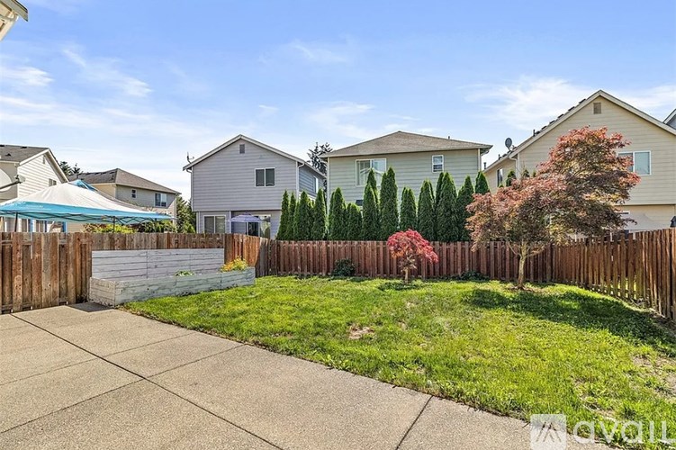 A kitchen with white appliances and cabinets.