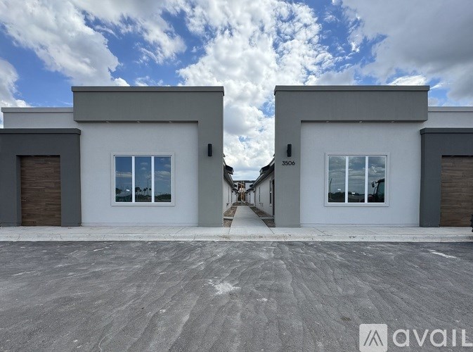 Two modern houses with the number 3506 on the right one.