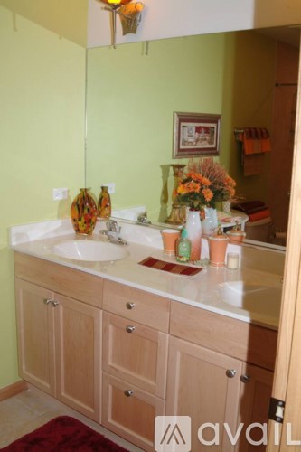 A bathroom with a sink and a mirror.