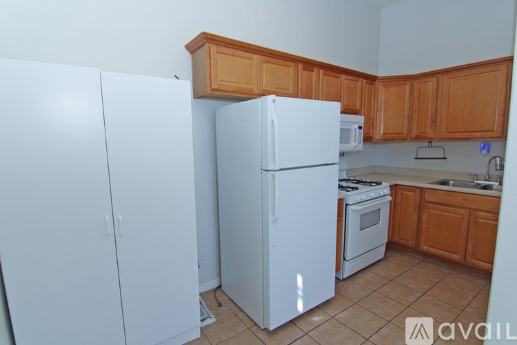 A kitchen with a white refrigerator and a white oven.