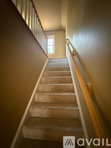 A staircase with a light at the end.