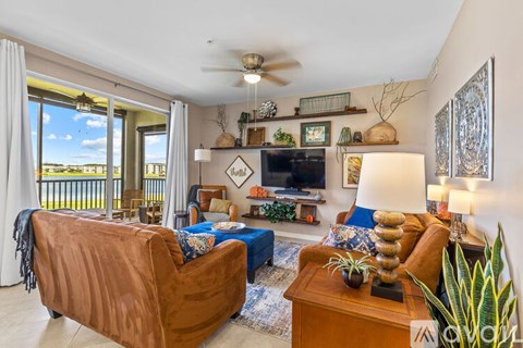 A living room with a brown couch and a television.