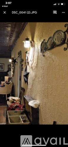 A wall with a clock and a light fixture.