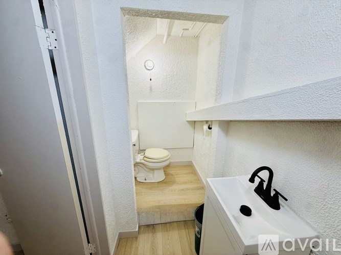 A small bathroom with a toilet and sink.