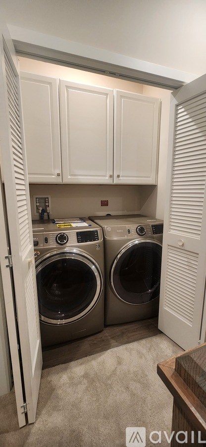 A laundry room with a washer and dryer.