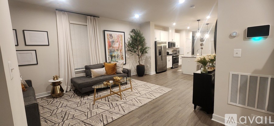 A living room with a grey couch and a coffee table.