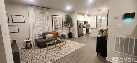 A living room with a grey couch and a coffee table.