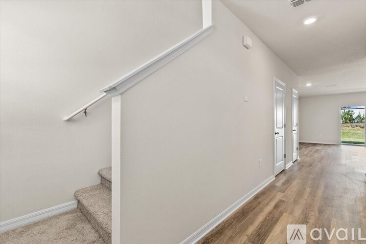 A room with a staircase leading to the upper floor.