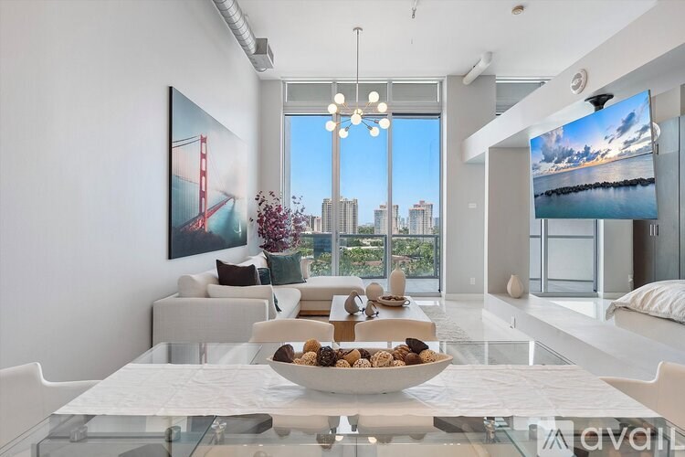 A modern living room with a view of the city skyline.