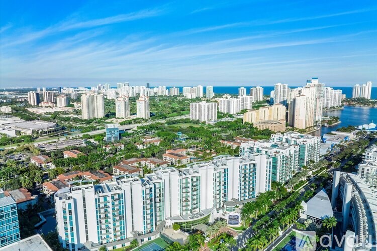 A cityscape with a mix of residential and commercial buildings.