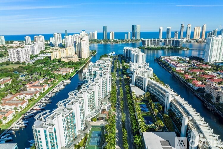 A cityscape with a river running through it.