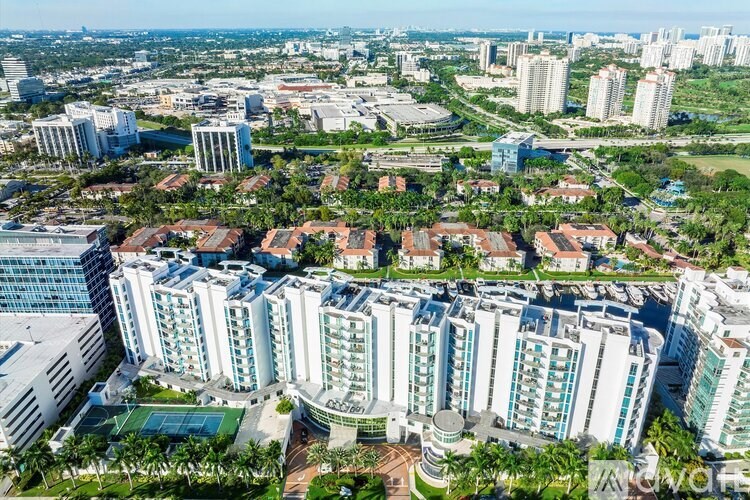 A bird's eye view of a city with a mix of residential and commercial buildings.