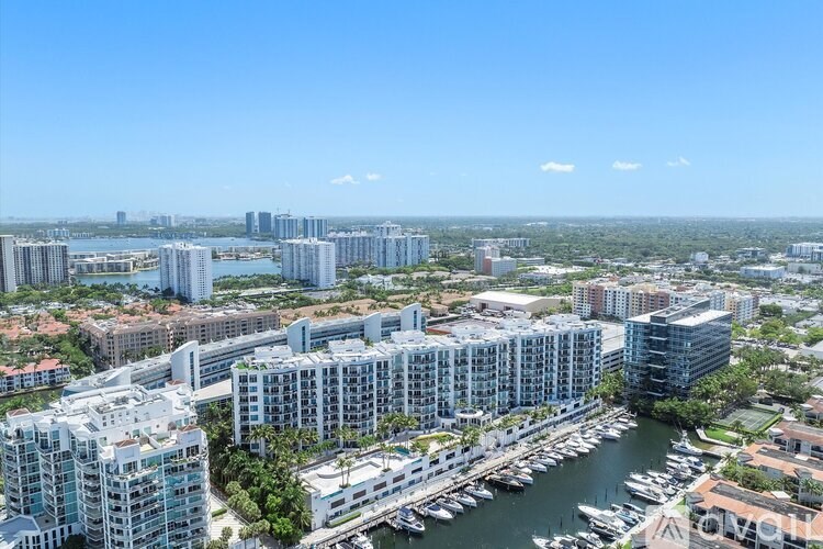 A cityscape with a marina and buildings.