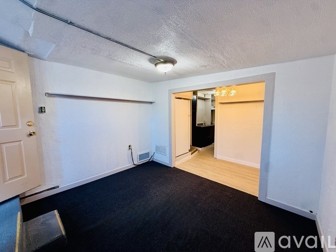 A room with a door and a window.