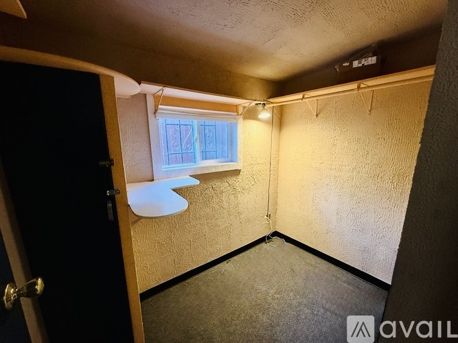 A small room with a window and a door.