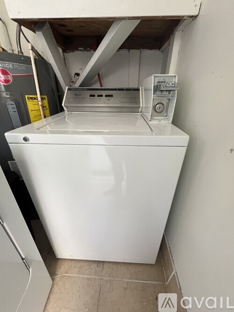 A white dishwasher is installed in a kitchen.