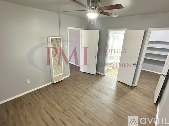 A room with a ceiling fan and wooden flooring is available for rent.