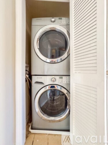 A washing machine is in a small space.