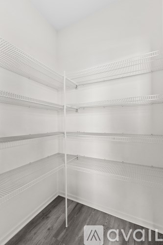 Empty white shelves in a room.