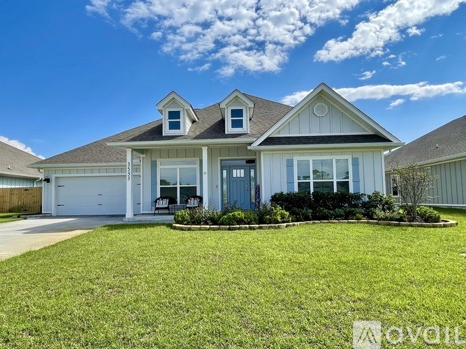 A two-story house with a large front yard.