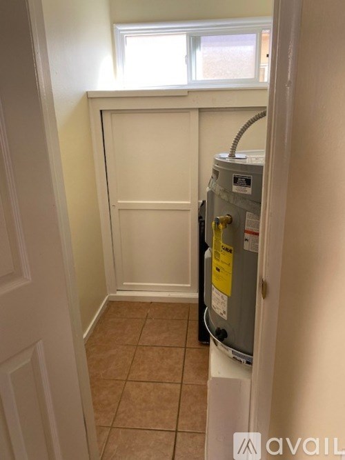 A water heater is installed in a small room.